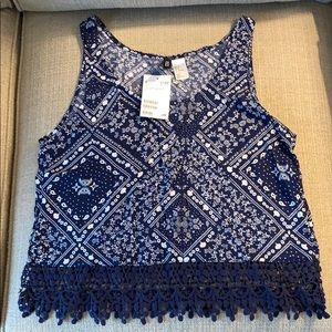 Navy blue and white sleeveless shirt